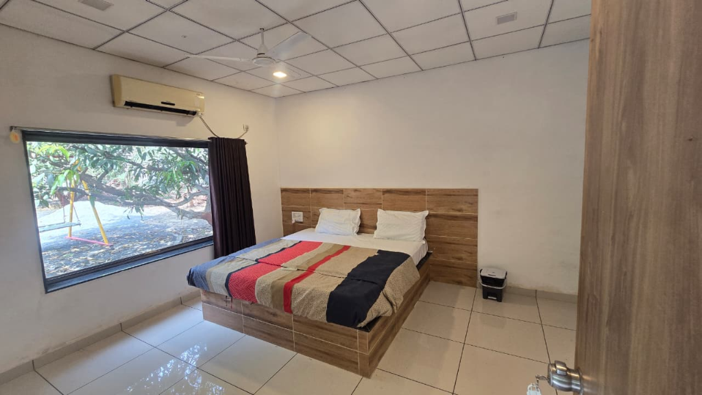 Deluxe AC room interior at Resort Saffron Indian Spice